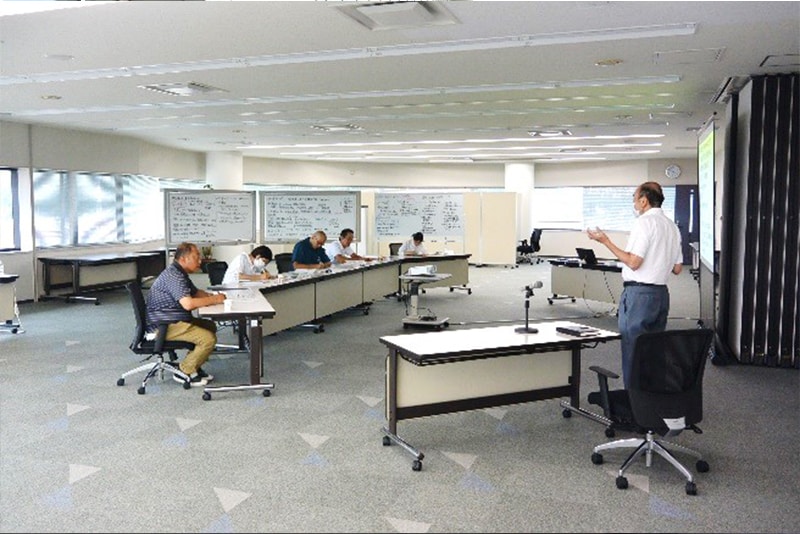 Teachers listening to a lecture on human resource development