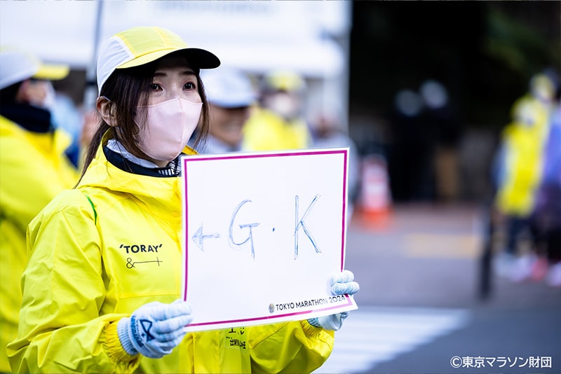 Volunteer staff wearing official clothing made from &+™ fiber