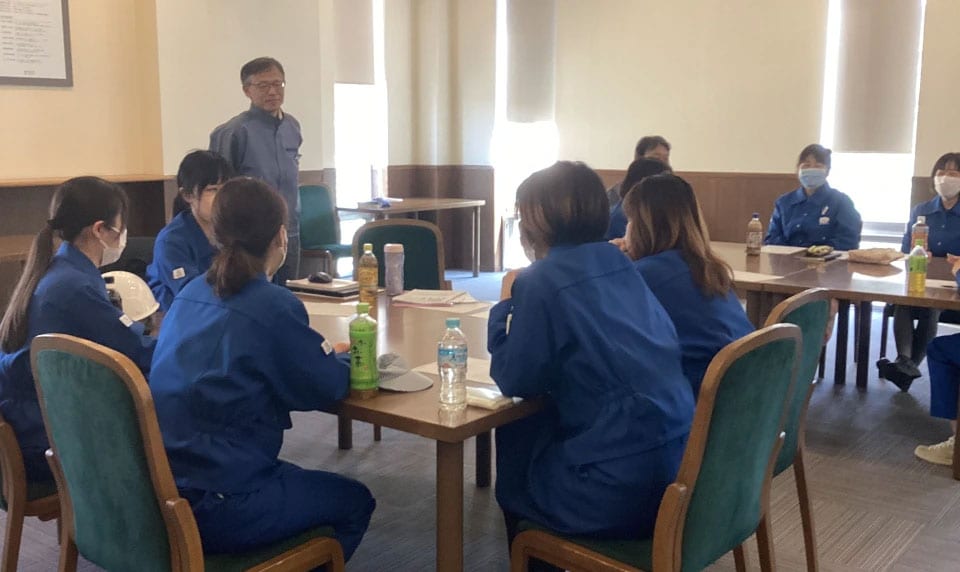 Ehime Plant manager observing discussions by female employees